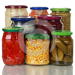 Preserved vegetables in glass jars photo