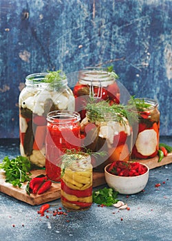 Preserves and pickles of different vegetables in jars