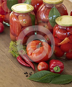 Preserves vegetables in glass on wood background, marinated fermented and pickled fermer food