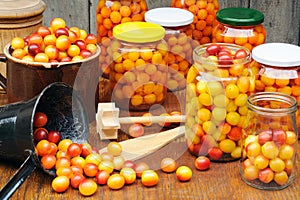 Preserving Mirabelle plums - jars of homemade fruit preserves