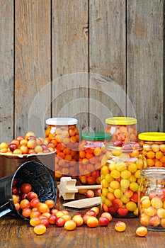 Preserving Mirabelle plums - jars of homemade fruit preserves