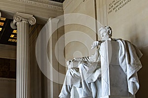 President Abraham Lincoln seated in his chair, the temple and pantheon on the National Mall in Washington DC, USA