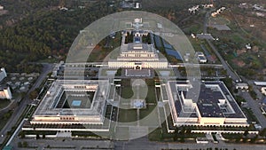 President House at sunset time, Parliament and Senate of Pakistan, Aerial Drone View of D Chowk Islamabad capital city.