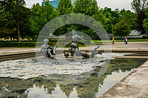 Presidential palace gardens with young girls sculpture, Bratislava, Slovakia. Prezidentsky palac photo