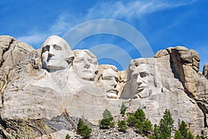 Presidential sculpture at Mount Rushmore national memorial, USA. Sunny day, blue sky. photo