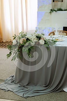 The presidium of the newlyweds in the banquet hall of the restaurant