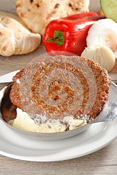 Presliced traditional burger patty called pljeskavica photo