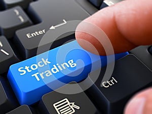 Press Button Stock Trading on Black Keyboard.