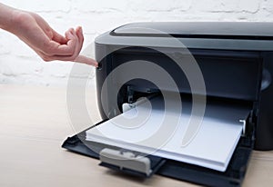 Press the button to enable or disable printer