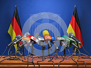 Press conference or briefing of premier minister of Germany concept,. Podium speaker tribune with Germany flags and coat arms