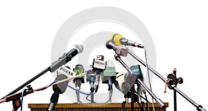 Press conference microphones on white background