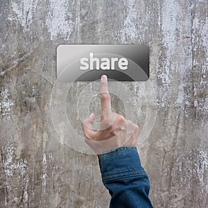 Press hand with jeans jacket on share botton photo