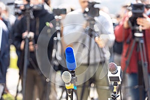 Press or news conference microphone in focus at media event