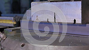 Press presses metal profile. Press presses steel bar. Sheet of metal and hands of worker who works on press. press