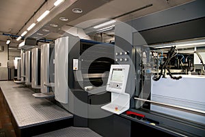 Press printing - Offset machine. Printing technique where the inked image is transferred from a plate to a rubber blanket, then to