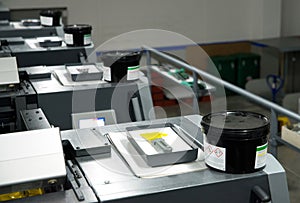 Press printing - Offset machine. Printing technique where the inked image is transferred from a plate to a rubber blanket, then to