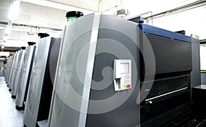 Press printing - Offset machine. Printing technique where the inked image is transferred from a plate to a rubber blanket, then to