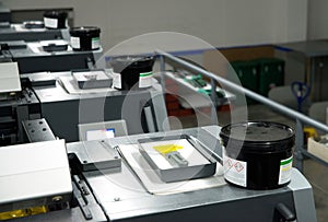 Press printing - Offset machine. Printing technique where the inked image is transferred from a plate to a rubber blanket, then to photo