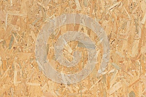 Pressed wooden panel background, seamless texture of oriented strand board - OSB wood