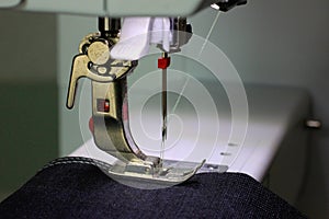 Presser foot of a sewing machine with dark fabric