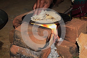 Pressing Bread to Make a Air in Roti on Tawa