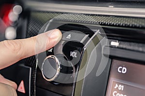Pressing the eject cd button of a car