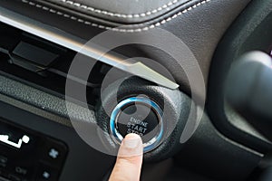 Pressing engine start stop button of a car