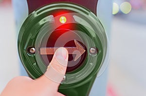 Pressing Pedestrian Crossing Button in Close-up View