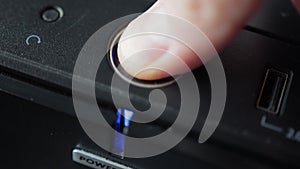 pressing your finger on the computer shutdown button on the system unit. Blue indicator, macro