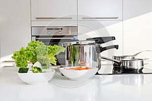 Pressure cooker and vegetables photo