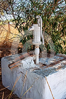 Pressure deep well hand pump. Old Hand water pump in the nature