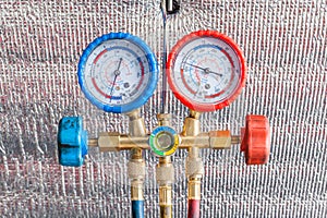 Pressure gauge for auto air conditioner recharge.