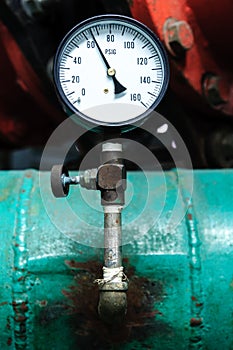 Pressure gauge on green pipe