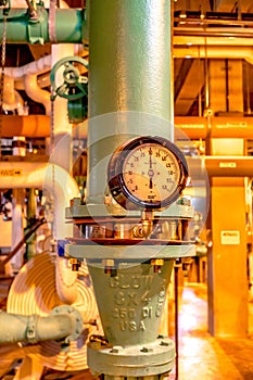 Pressure gauge and knobs control at a plant