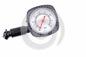 Pressure gauge for measuring air pressure in automobile tires isolated on white