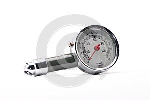 Pressure gauge for measuring air pressure in car tires on a white background