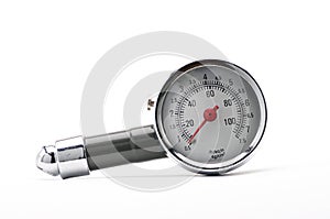 Pressure gauge for measuring air pressure in car tires on a white background