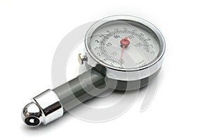 Pressure gauge for measuring air pressure in car tires on a white background