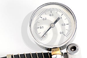 Pressure gauge for measuring air pressure in car tires on a white background