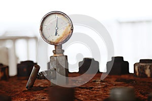 Pressure gauge using measure the pressure in production process. Worker or Operator monitoring oil and gas process by the gauge