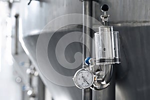 pressure gauges for measuring pressure in beer tanks at modern brewery