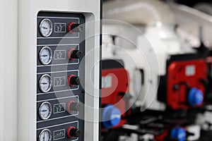 pressure gauges and regulators on control panel