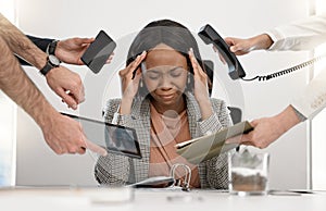 The pressure is getting the best of her. a young businesswoman feeling stressed out in a demanding office environment.
