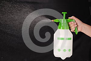 Pressure sprayer bottle in hand