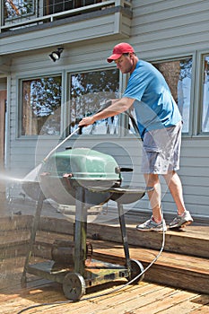 Pressure washing outdoor barbecue