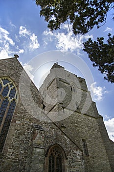 Presteigne church window, tower and yew tree in Powys, Wales. photo