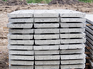 Prestressed Floor planks stacked for construction. It is a slab of reinforced concrete. Put together Structural Topping concrete
