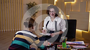 Preteen boy choosing colored ball at psychologist