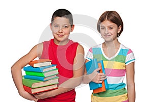 Preteen boy and girl with books