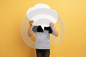Preteen child holding empty white communication bubble over his head